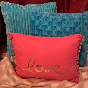 Decorative teal blue and orange live pillows